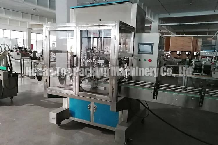 Linear filling machine with protective cover